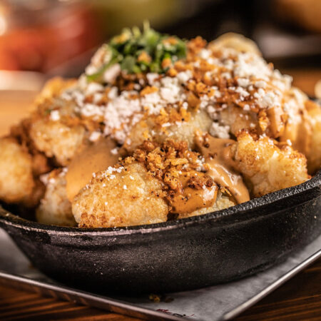 Papas de Galeana photo of a small iron skillet with small baked potatoes